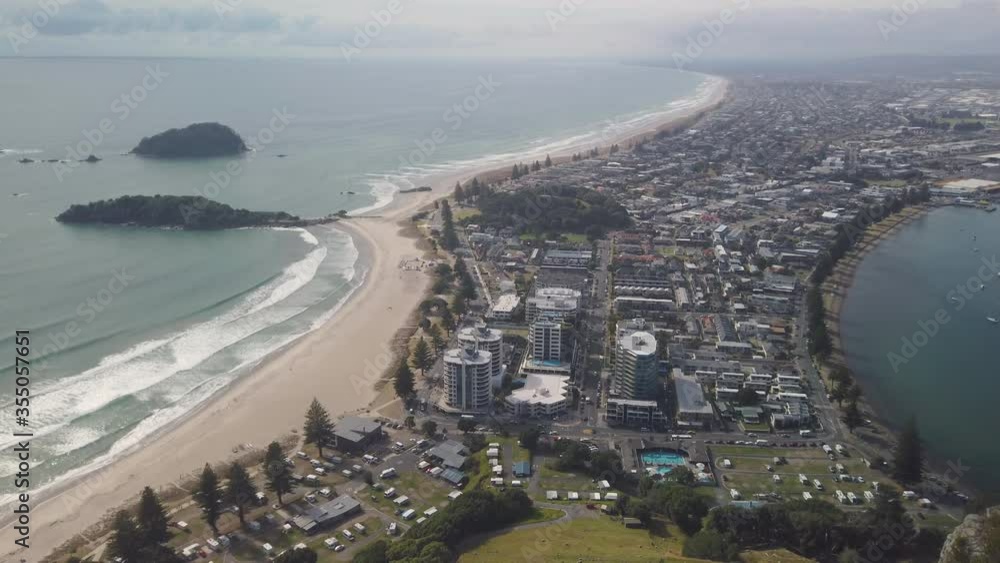 4k slight tilt top to bottom pan of the township of Mount Maunganui,view from top of the mountain,Mt Maunganui know as a holiday destination and for walking,climbing of the mountain,New Zealand 4k slight tilt top to bottom pan of the township of Mount Maunganui,view from top of the mountain,Mt Maunganui know as a holiday destination and for walking,climbing of the mountain,New Zealand