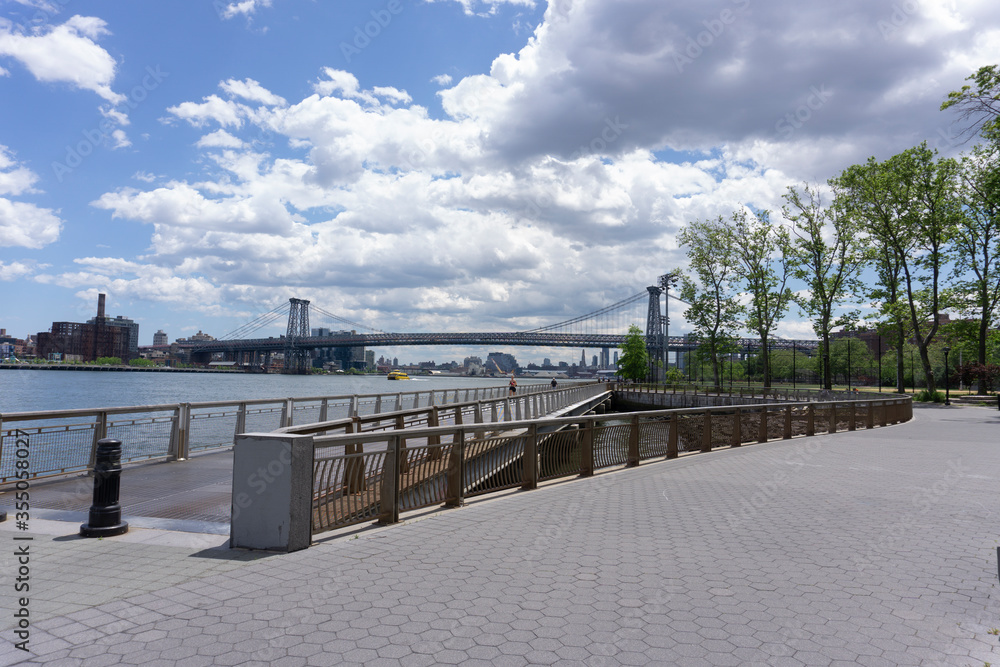 An empty promenade along East River in lower Manhattan