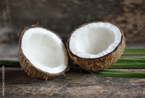 Coconut isolated on wooden background.