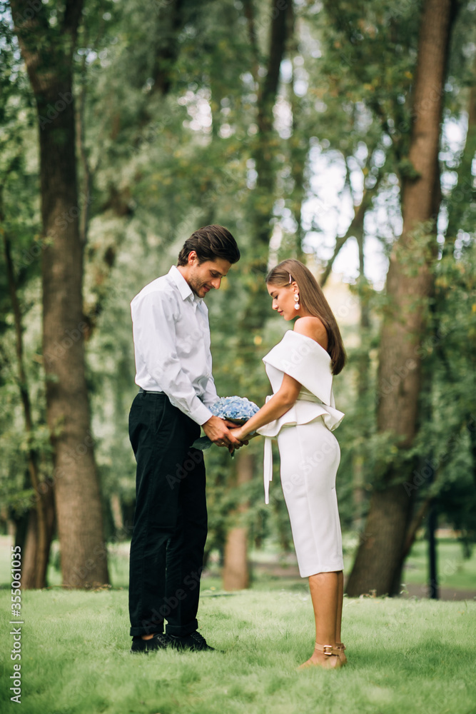 Couple Getting Married Standing Holding Hands During Ceremony In Forest Couple Getting Married Standing Holding Hands During Ceremony In Forest