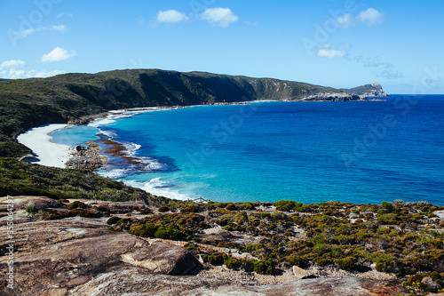 Beautiful view of cliff coast and Cable Beach at Torndirrup National Park, Albany beach, Western Australia, Wild Southern Ocean, blue sky on sunny day. Selective focus.