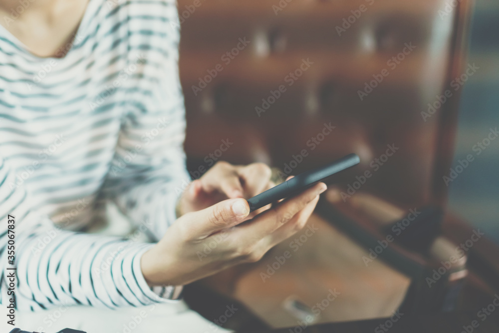 Womanhand using smartphone to do work business, social network, communication in public cafe work space. Womanhand using smartphone to do work business, social network, communication in public cafe work space.
