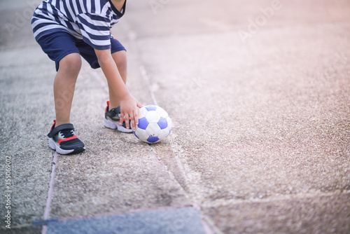 soccer player kicking ball