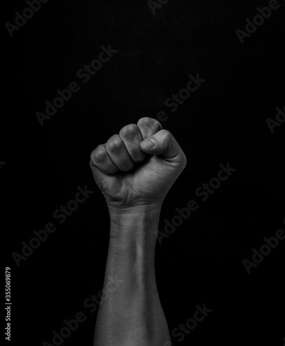 Black Lives Matter. Human hand. Fist raised up. Protest Against Racism. photo