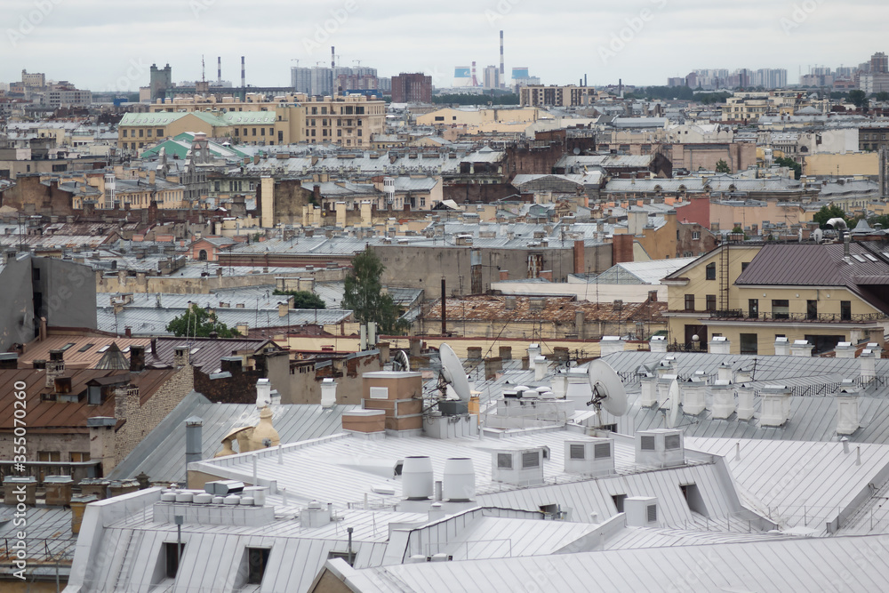 Fototapeta premium View on Saint Petersburgs' roofs from a cathedral height. Saint Petersburg in different directions.