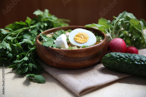 products ingredients for okroshka, summer soup or salad on a wooden background