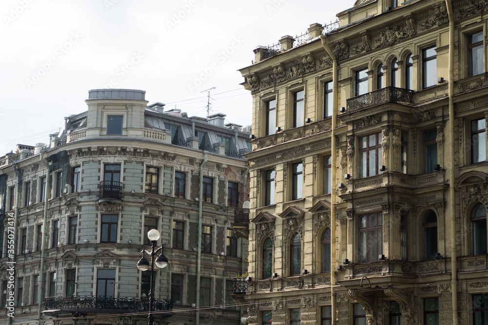 a corner side by side of two typical classic buildings of Saint Petersburg on Nevsky prospect