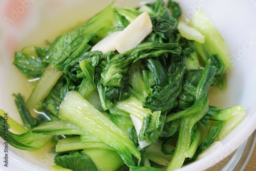 Close up view of Pak Choi in a white plate   