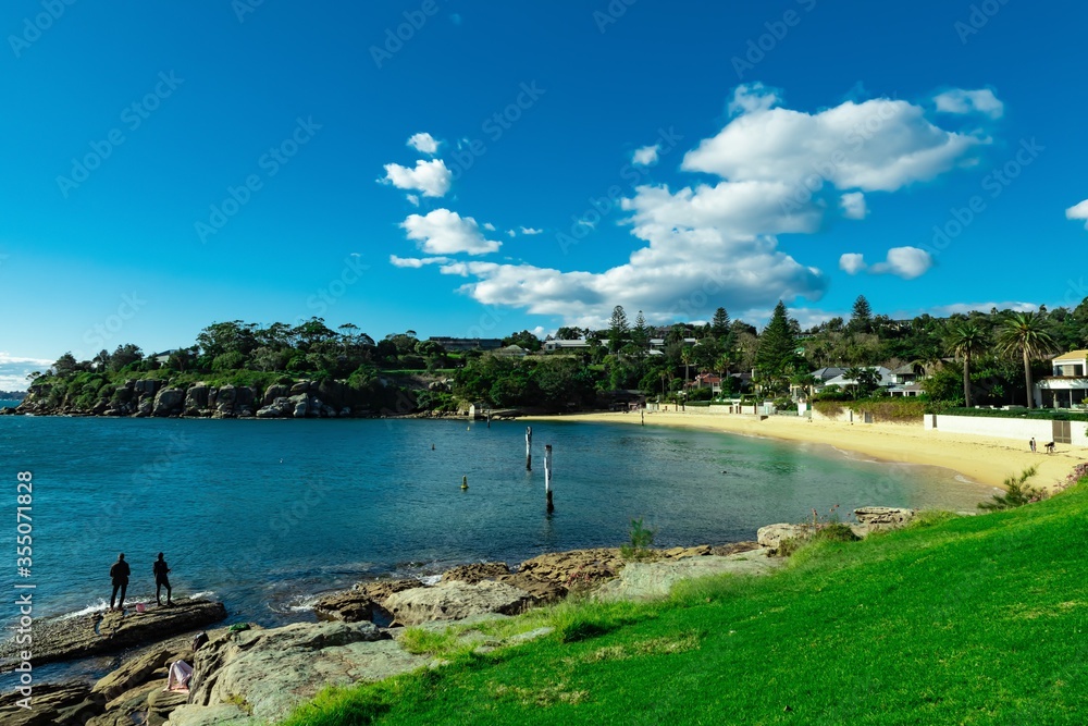 Camp cove Beach on a warm winder day in Sydney NSW Australia nice blue water sunny day blue partly cloudy skies