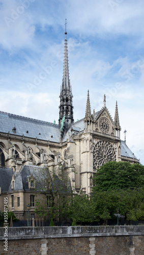 Notre Dame de Paris in a beautiful summer day. Side shots on the church s peak