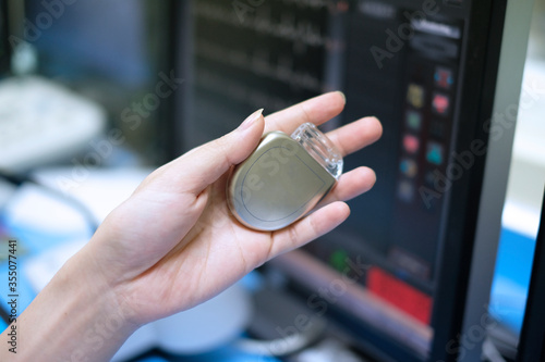 This image demonstrates Implantable cardioverter defibrillator (ICDs) on hands photo