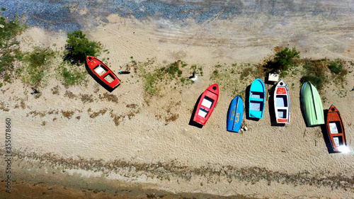 Aerial shot of fishing boats on the beach in Halkidiki Greece