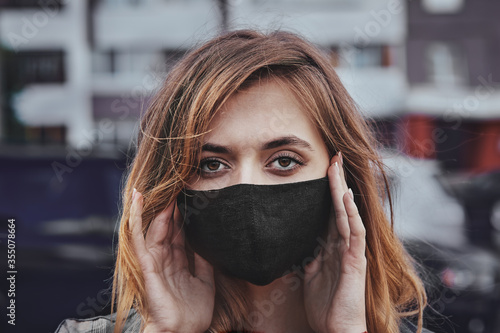 Portrait of concerned teenage girl to wear protective face masks