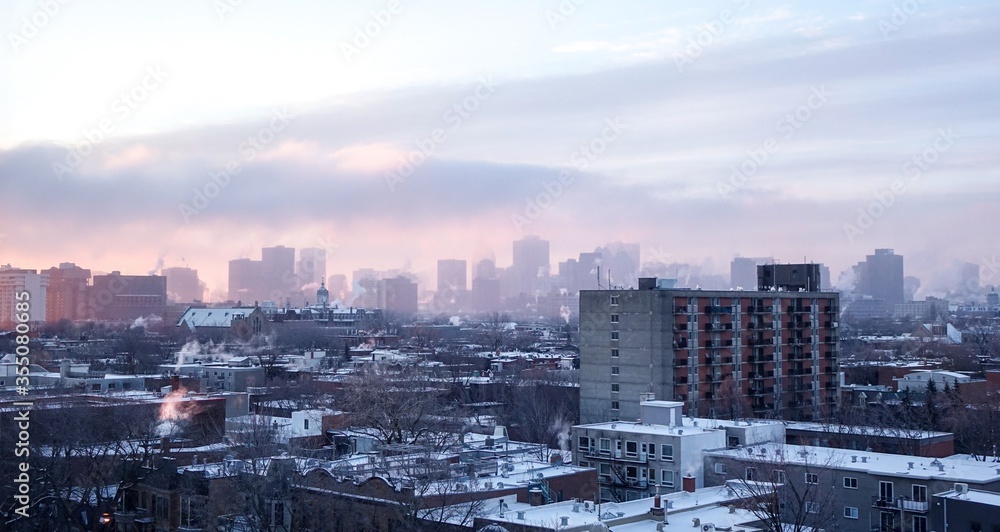 Plateau district of Montreal from 10th floor looking towards hazy morning Down Town