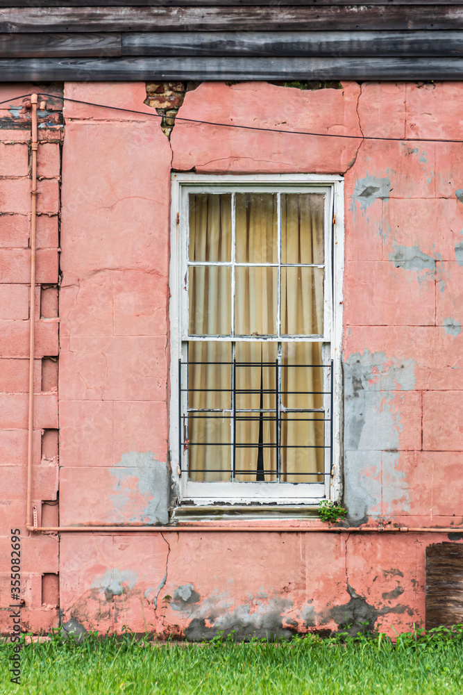 Old wooden window on a pink wall background