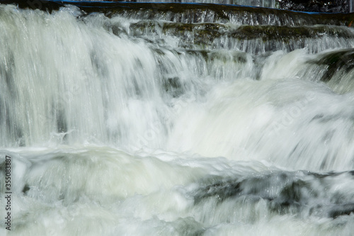 Broad Brook cascades over a waterfall in East Windsor, Connecticut.
