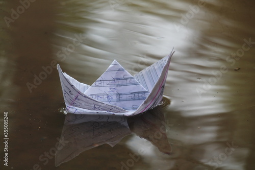 Paper boat driving on the water
