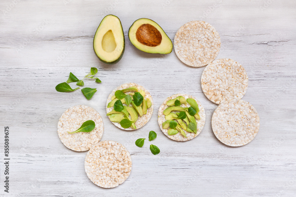 Crispy rice cakes with sliced avocado. Healthy and fresh breakfast. Healthy and vegan concept 