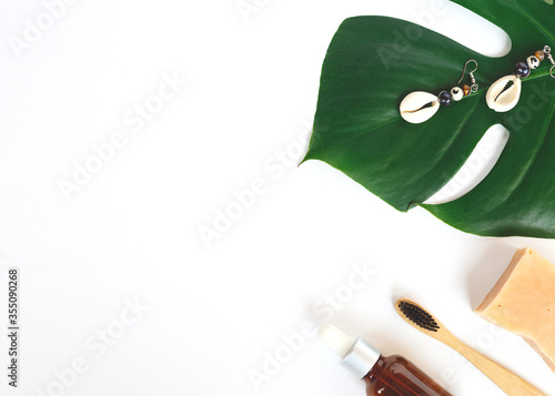 The concept of zero waste. bamboo toothbrush, monstera leaf photo