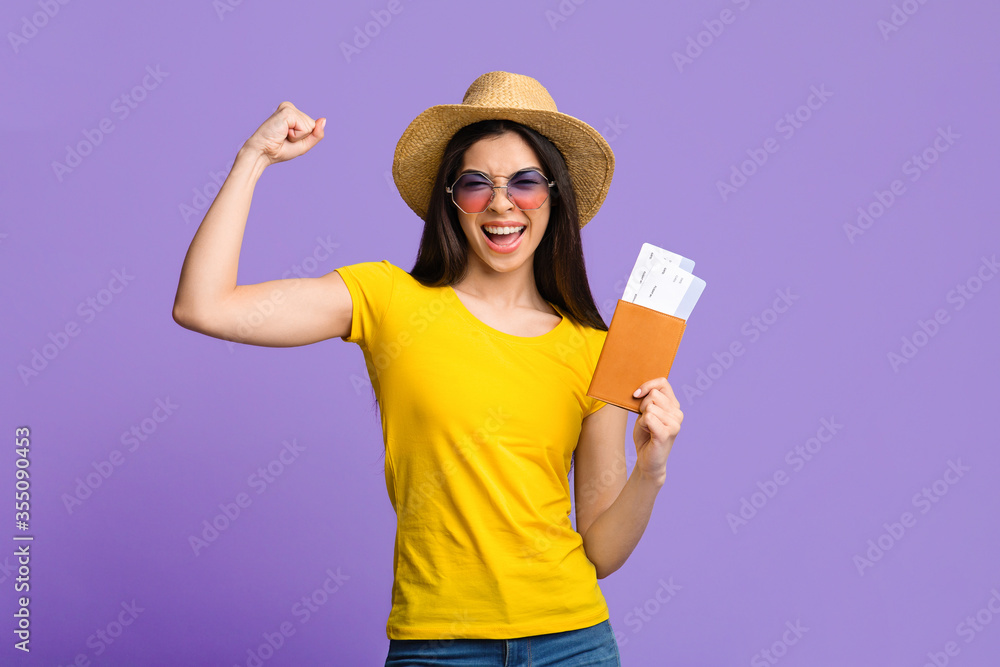 Travel Time. Joyful Asian Girl With Tickets And Passport Over Purple Background Travel Time. Joyful Asian Girl With Tickets And Passport Over Purple Background