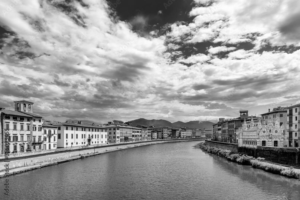 Beautiful black and white view of the Lungarni of Pisa, Italy, of the historic center with the Church of Santa Maria della Spina from the Solferino bridge