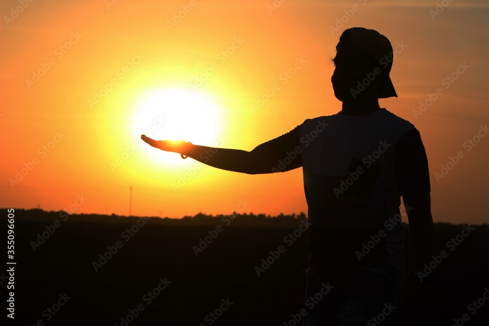 Fototapeta premium silhouette of a man in sunset