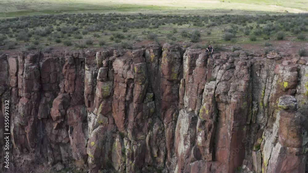 rock climber sitting on the ledge of the world rock climber sitting on the ledge of the world