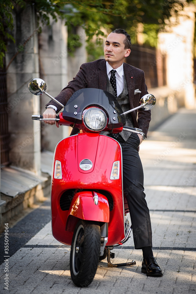 Fototapeta premium young man on a scooter