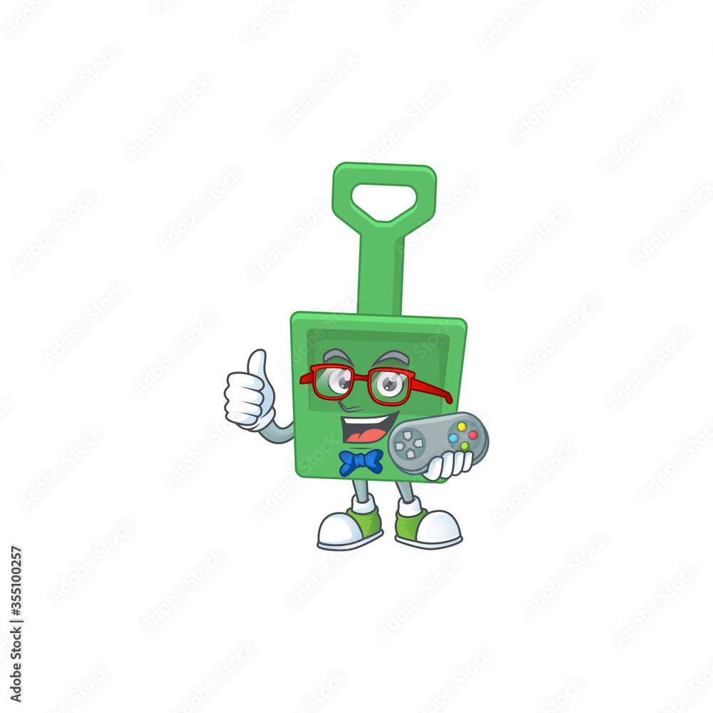 Cartoon mascot design of green sand bucket play a game with controller