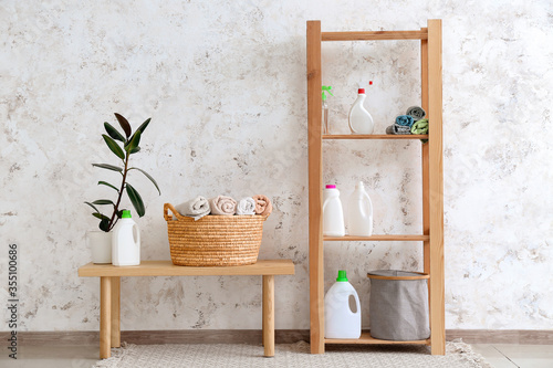 Baskets with clean towels and detergents in laundry room
