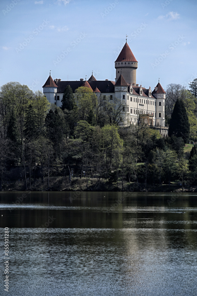 Konopiste chateau on the hill by the lake with single tower