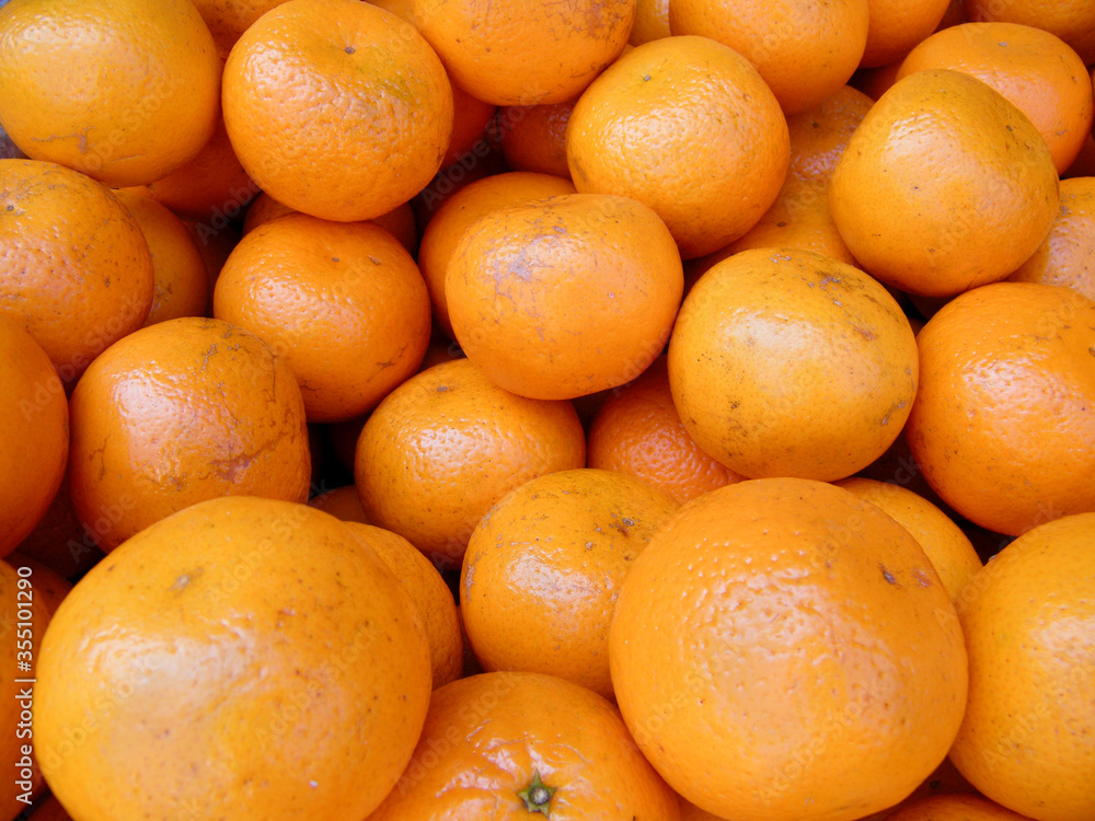 Many Fresh Raw Oranges on a Market Stall. Many Fresh Raw Oranges on a Market Stall.