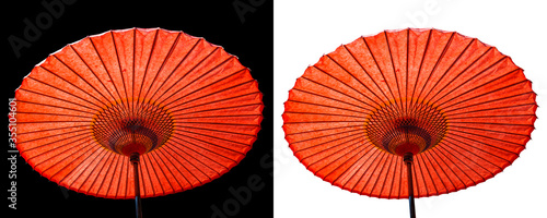 Japanese red umbrella isolated on black and white background.