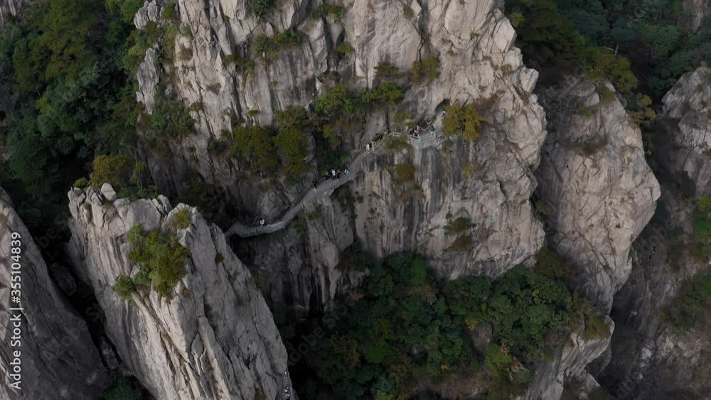 Amazing Yellow Mountain (Huangshan) walking trail route on mountainside, aerial view Amazing Yellow Mountain (Huangshan) walking trail route on mountainside, aerial view