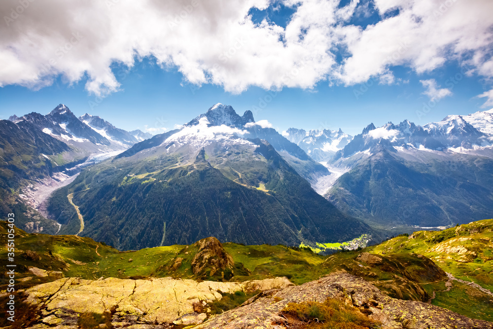 Panorama of snowy peaks on a sunny day. Location place Mont Blanc glacier, Chamonix resort, France, Europe.