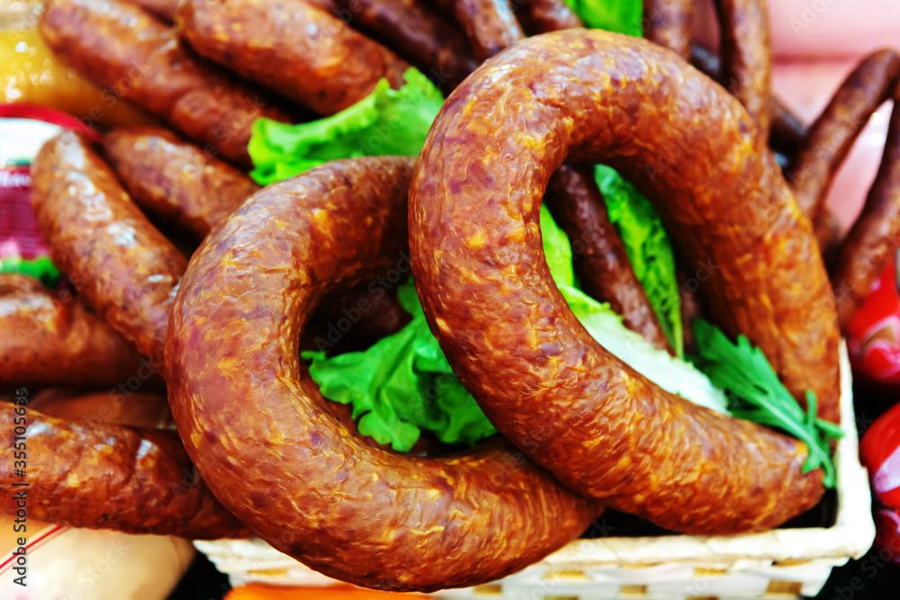 Smoked sausage in the form of a ring on the counter Smoked sausage in the form of a ring on the counter