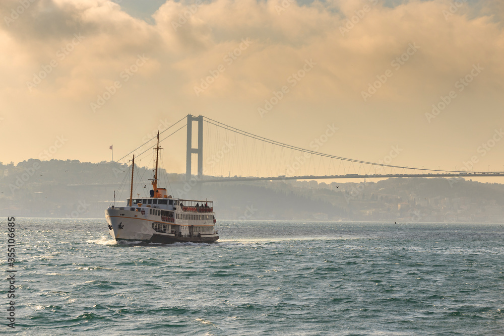 Tourists boat cruise in the Bosphorus strait, Istanbul, Turkey.