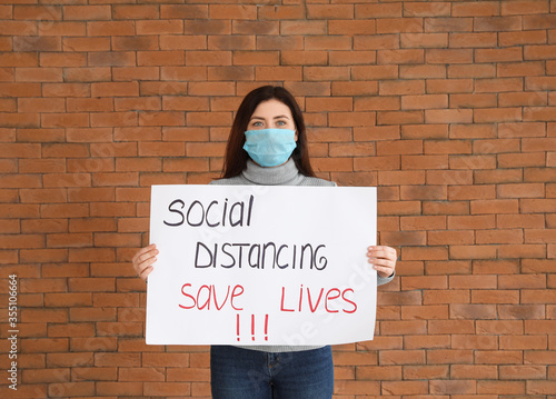 Young woman holding paper w...