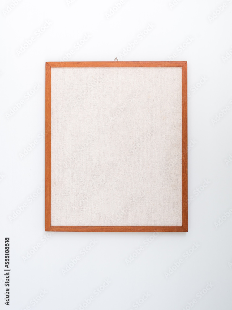 Obraz premium Blank sandy brown canvas on wooden frame.
