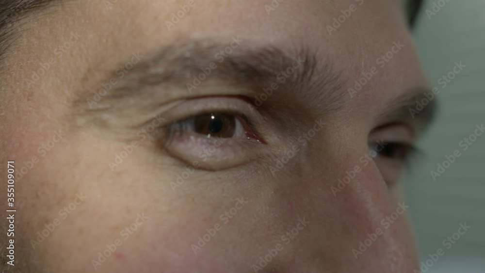 High quality close-up 4k slow motion video of a man eye blinking during the conversation High quality close-up 4k slow motion video of a man eye blinking during the conversation