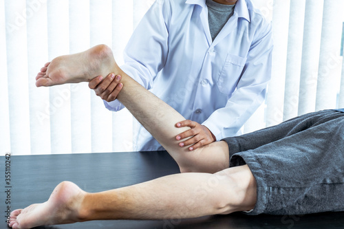 Physical therapy is doing leg therapy for patients in the hospital