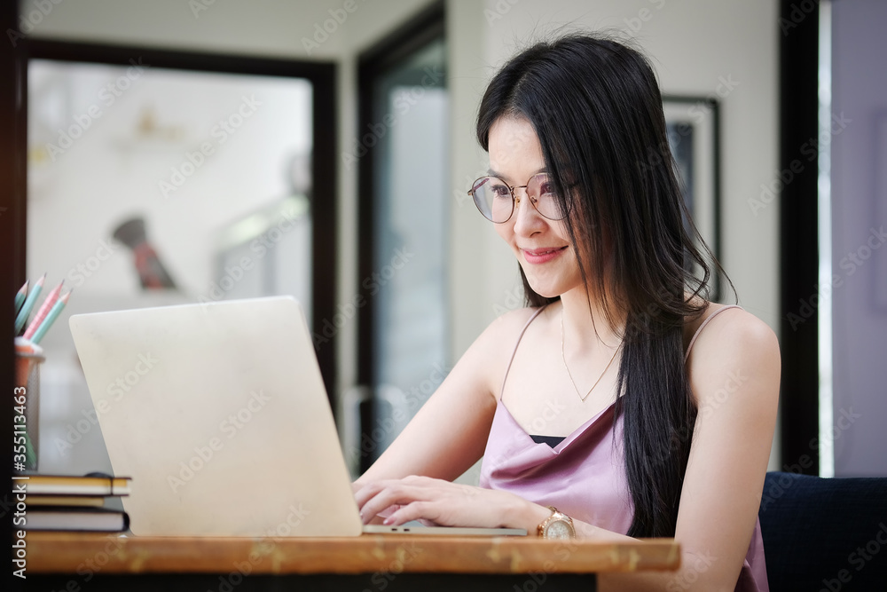 Business women work from home living room enjoying sunny morning on the day with documents and laptop people Consulting and business planning. Business women work from home living room enjoying sunny morning on the day with documents and laptop people Consulting and business planning.