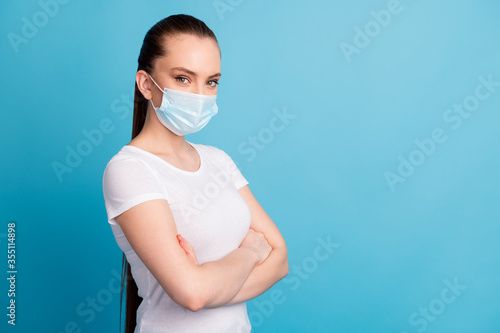 Profile photo of self-confident assert lady hospital examination business center listen doctor arms crossed wear protect face medical mask white t-shirt isolated blue color background © deagreez
