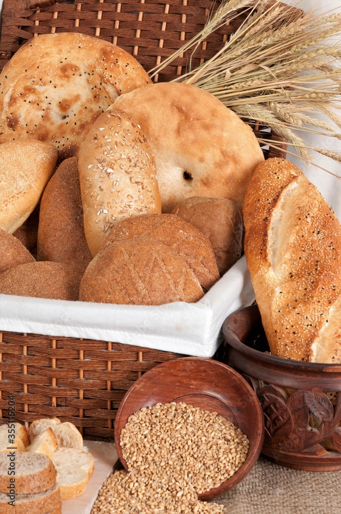 
Bread types made of white wheat flour and rye flour. Wheat and breads on the table. Types of wholemeal bread.