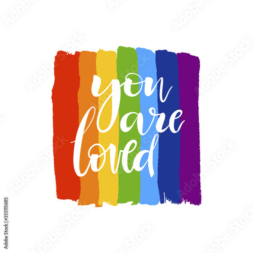 Brush drawn rough stripes on white background in rainbow colors and You are loved lettering. LGBT culture sign. Gay pride design element. 