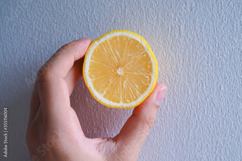 lemon in hand holding.