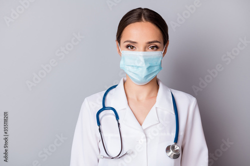 Closeup photo of attractive serious virologist doc lady experienced professional listen patient wear facial mask medical uniform lab coat stethoscope isolated grey background