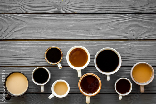 Lots of coffee on wooden table top view copy space photo