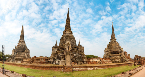 Panorama of temple ruins of old Siam capital Ayutthaya historical architecture of Thailand. View to three white chedies of Wat Pra Si Sanphe