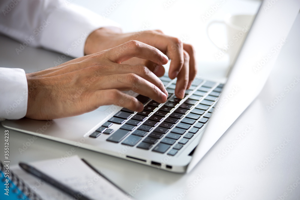 Closeup of businessman's hands working with laptop Closeup of businessman's hands working with laptop
